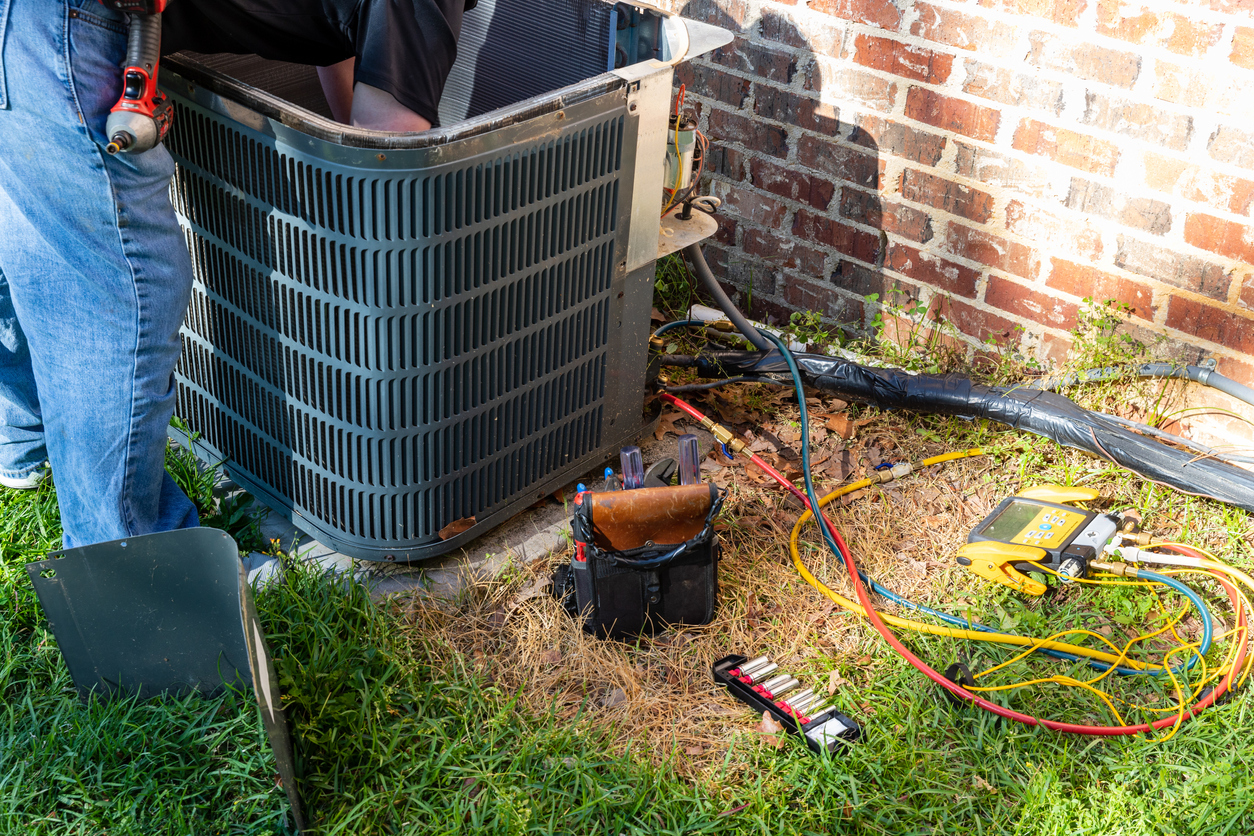 Air conditioner maintenance is being performed